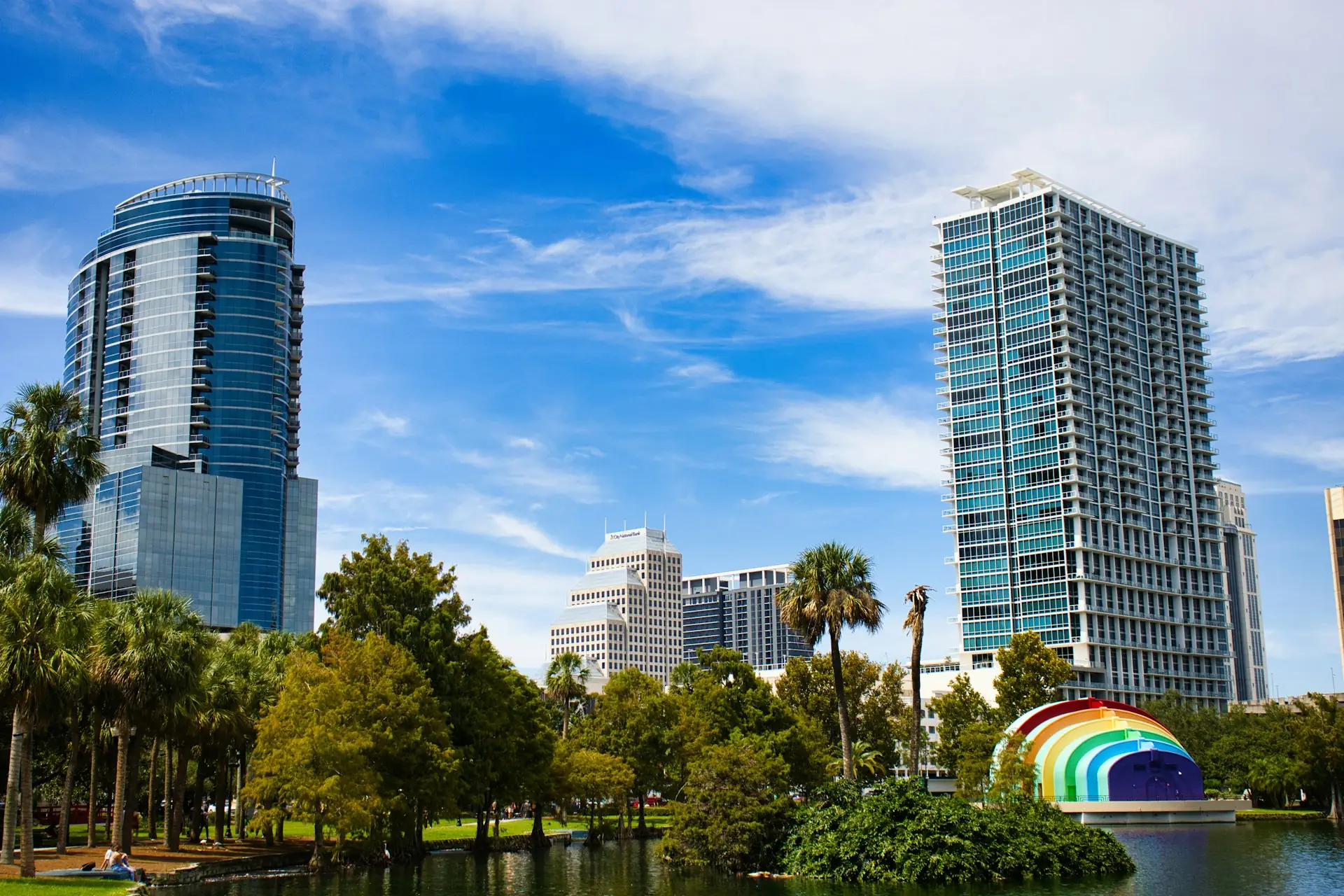 Downtown Orlando towers above the park at Lake Eola